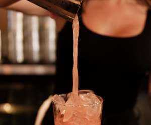 bartender pouring a cocktail