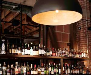bar with overhead lighting at Far Corner Pizza