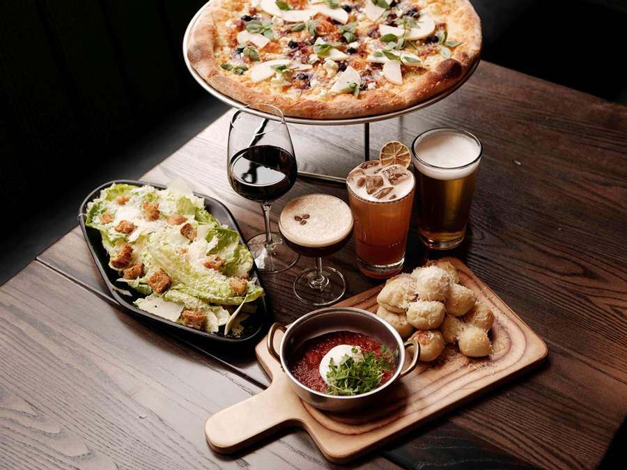 salad, pizza, garlic knots, and beverages at Far Corner