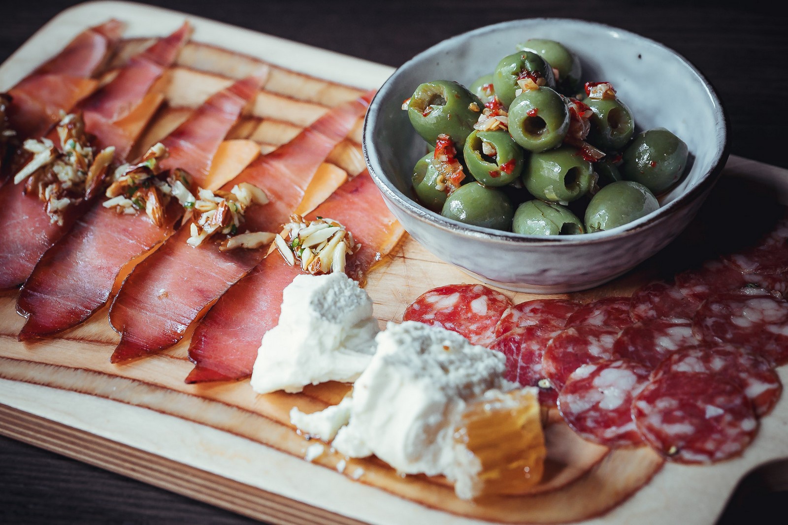 Charcuterie board with olives and cheese - Far Corner