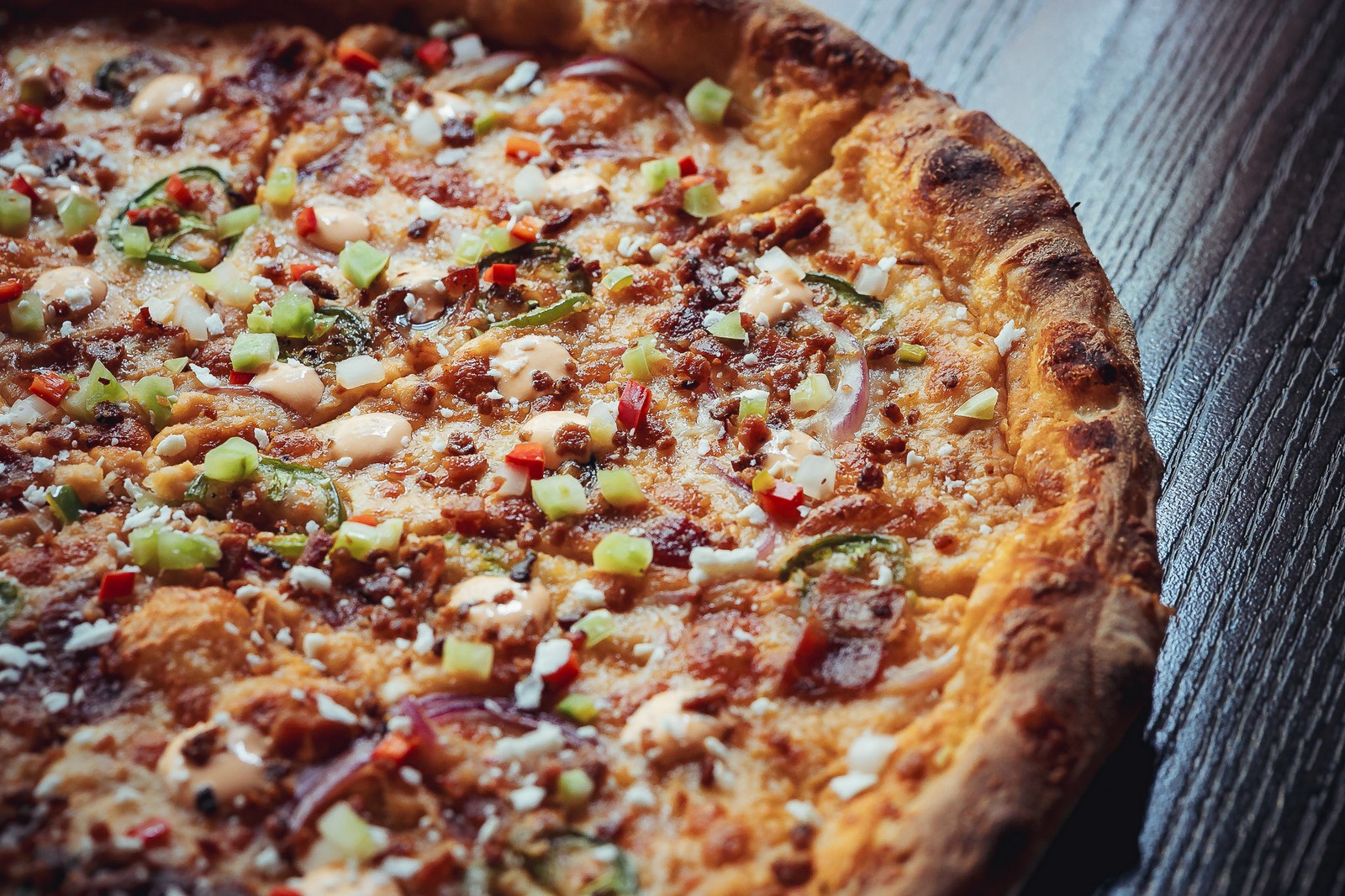 Pizza fresh from the oven, overhead - Far Corner Pizza fresh from the oven, overhead - Far Corner