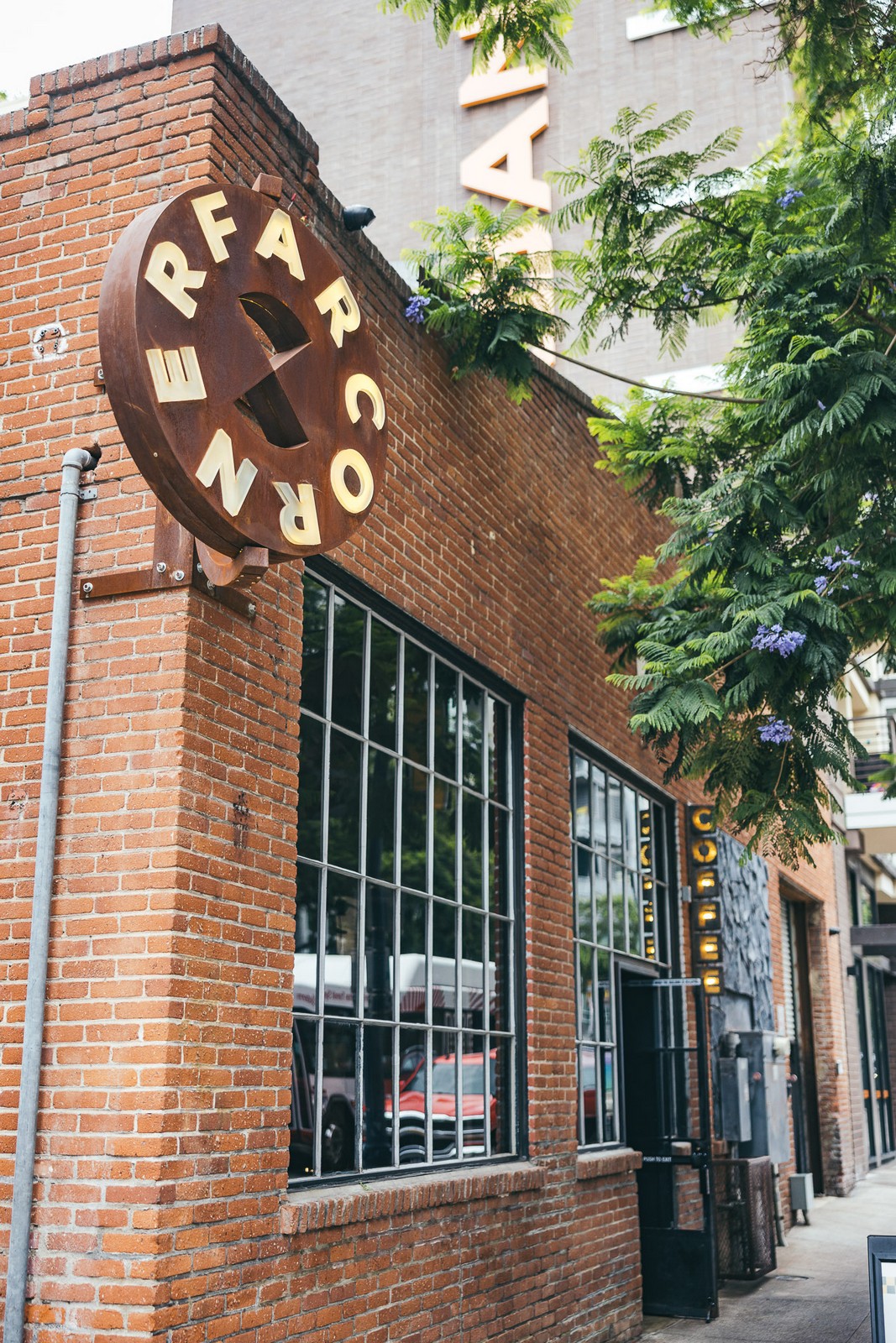 Round Far Corner sign on the brick corner of Tenth Ave, East Village San Diego Round Far Corner sign on the brick corner of Tenth Ave, East Village San Diego