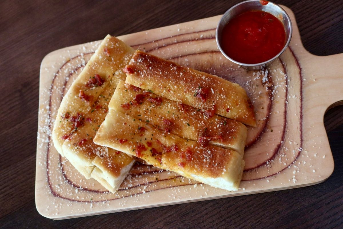 Bruschetta sticks with marinara, a shareable catering favorite at Far Corner