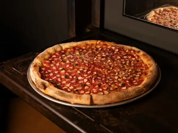 Marinara Garlic marinara pizza on a pizza stand